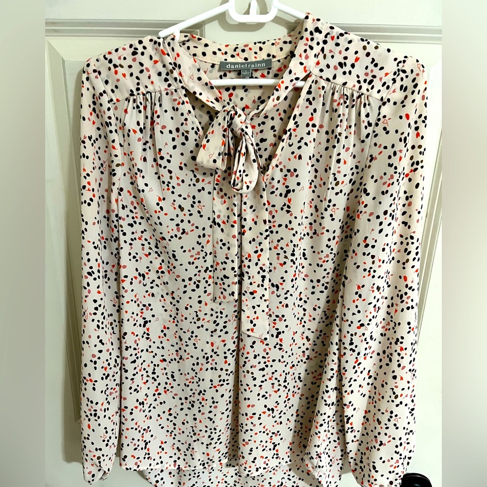 Woman’s blouse. Beige light pink base color